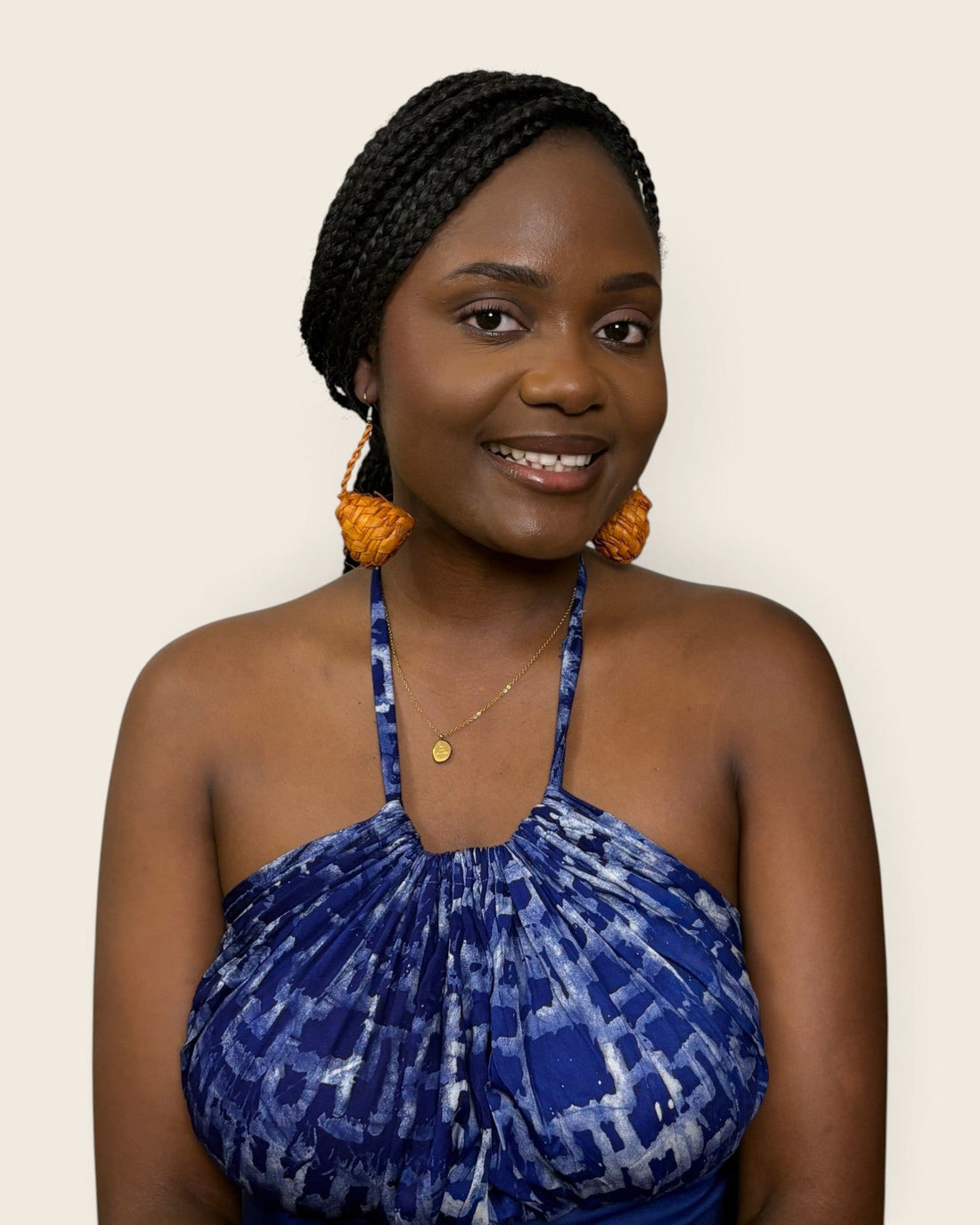 Amber raffia teardrop earrings worn with a hand-dyed indigo halter dress