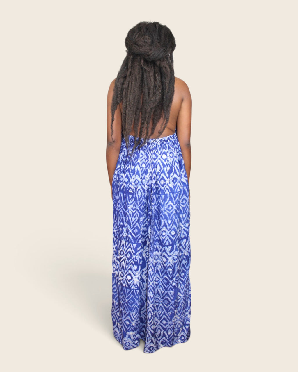 Backview of crepe backless adire halter maxi dress in indigo