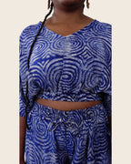 Simi Lapis Ripple — hand-dyed Adire fabric detail, silvery concentric rings on lapis blue, close-up of the V-neck crop top and drawstring waist, L'atelier KaAy