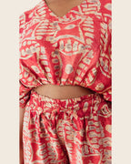 Simi Coral Fern — hand-dyed Adire fabric detail, sand fern motifs and smoky grey dots on coral red, close-up of the V-neck crop top and drawstring waist, L'atelier KaAy