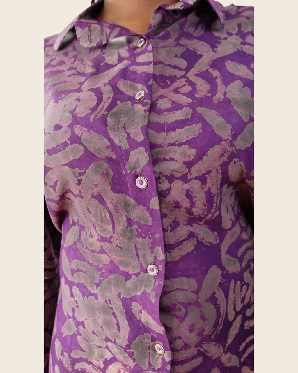 Adunni Violet Smoke — hand-dyed Adire fabric detail, smoky grey and mauve motifs on vivid violet, close-up of the collar and buttons, L'atelier KaAy
