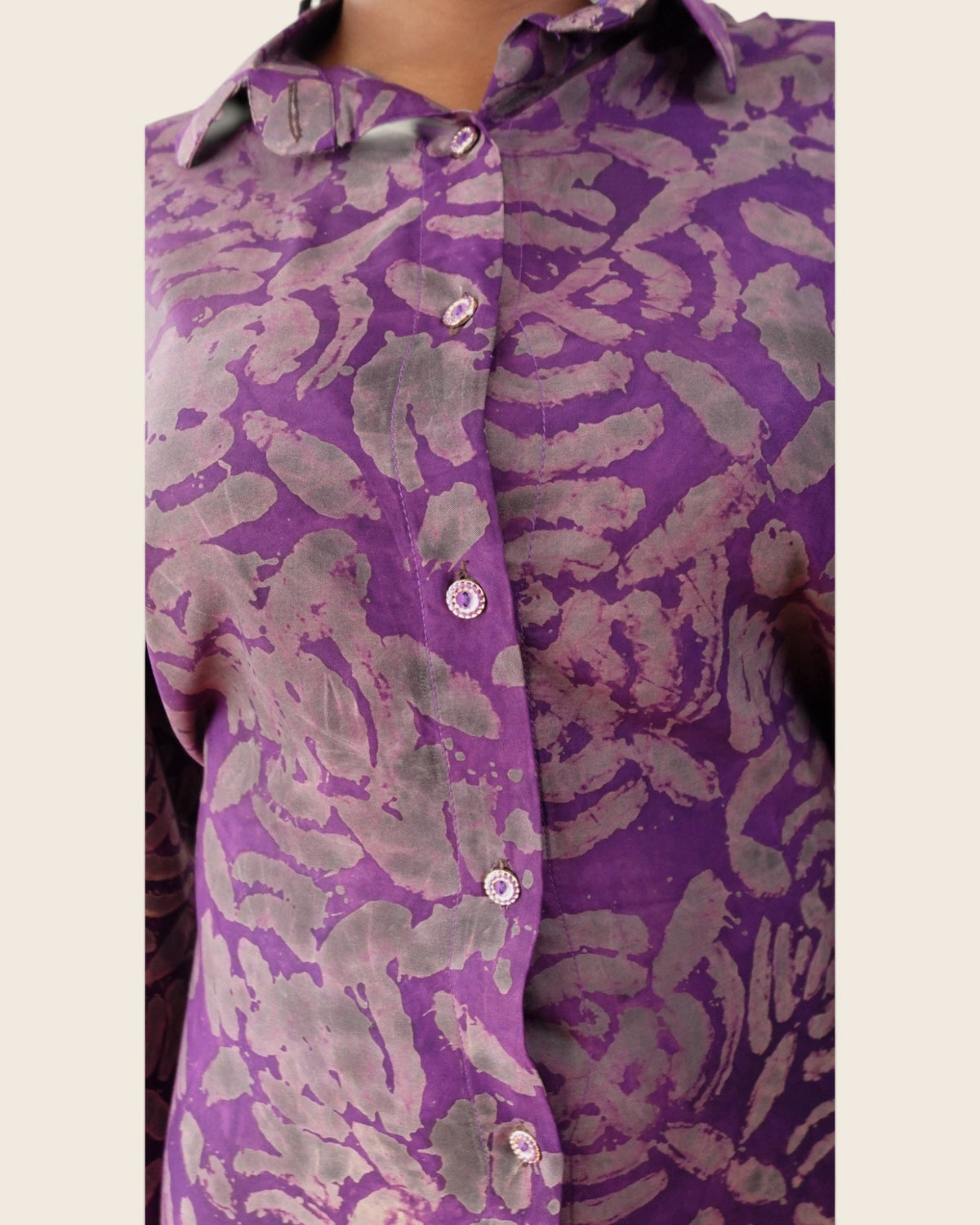 Adunni Violet Smoke — hand-dyed Adire fabric detail, smoky grey and mauve motifs on vivid violet, close-up of the collar and buttons, L'atelier KaAy