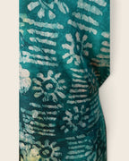 Adunni Teal Blossom — hand-dyed Adire fabric detail, ivory and lime flowers on deep teal, close-up of the fabric, L'atelier KaAy