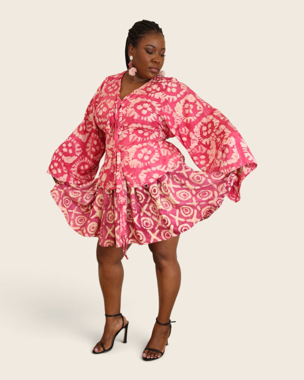 Aïna Hibiscus Pink — african print skirt set in hand-dyed Adire, front view, skirt held out, L'atelier KaAy