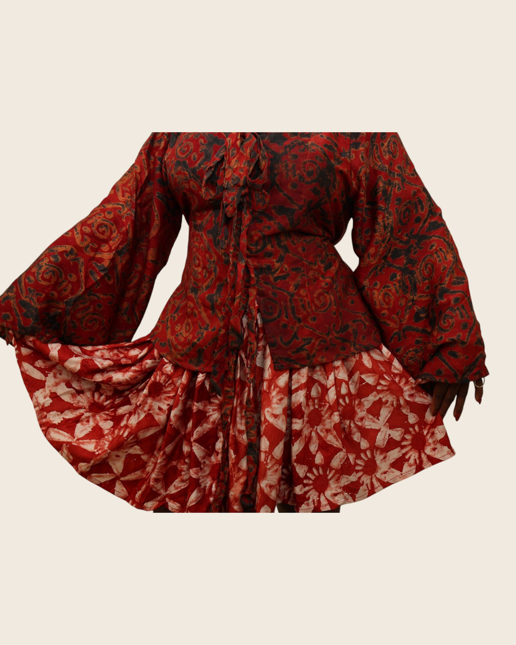 Aïna Ember Red — african print skirt set in hand-dyed Adire, close-up of the wrap top, skirt held out, L'atelier KaAy