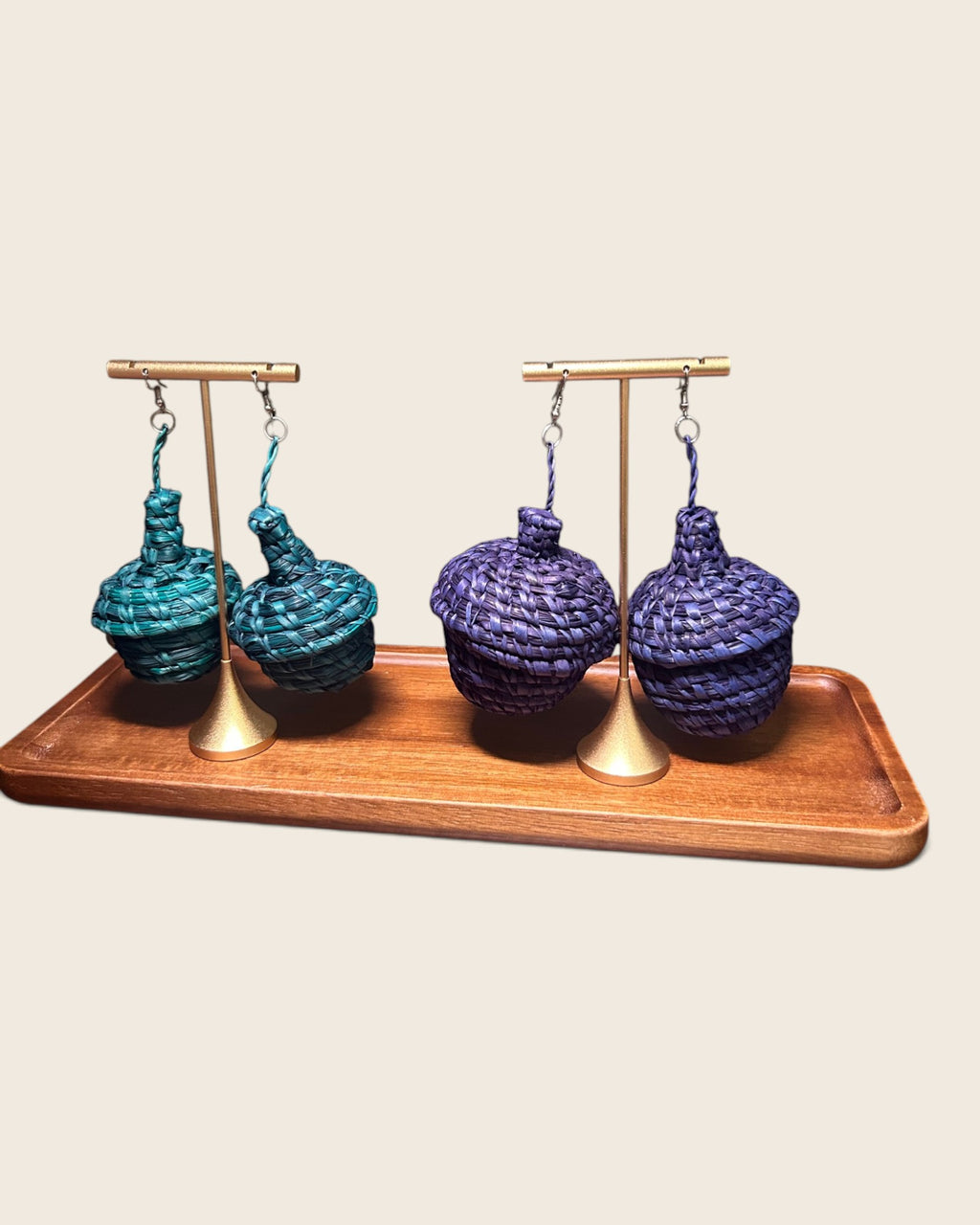 Deep Teal and Royal Violet raffia basket drop earrings side by side on a wooden tray, L'atelier KaAy