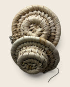 Close-up of the hand-coiled spiral on undyed Natural raffia halo earrings, L'atelier KaAy