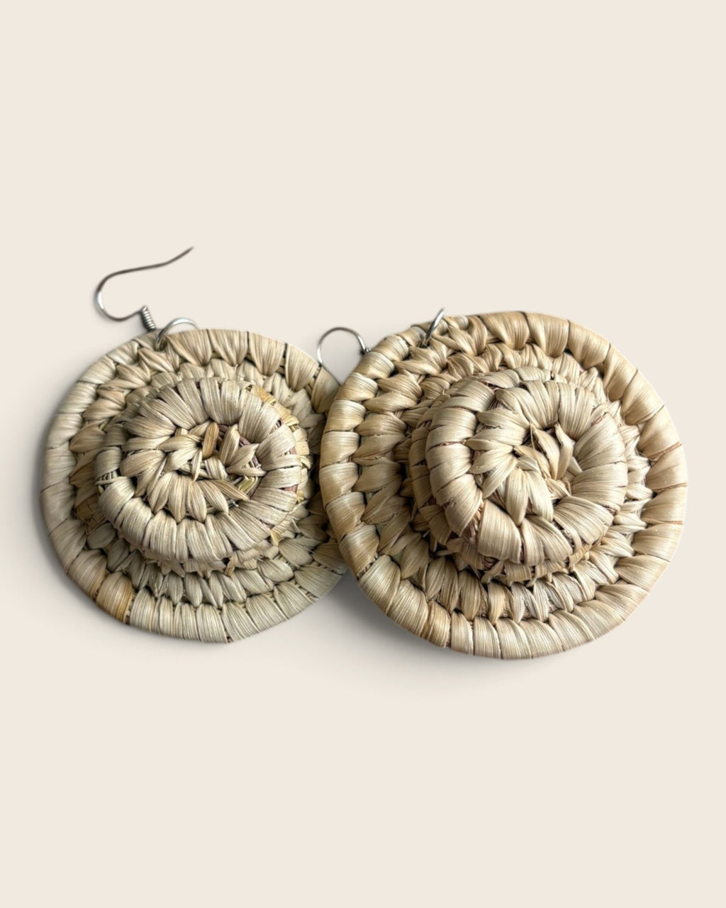 Natural undyed raffia halo earrings, a single coiled disc hand-woven in Nigeria, L'atelier KaAy