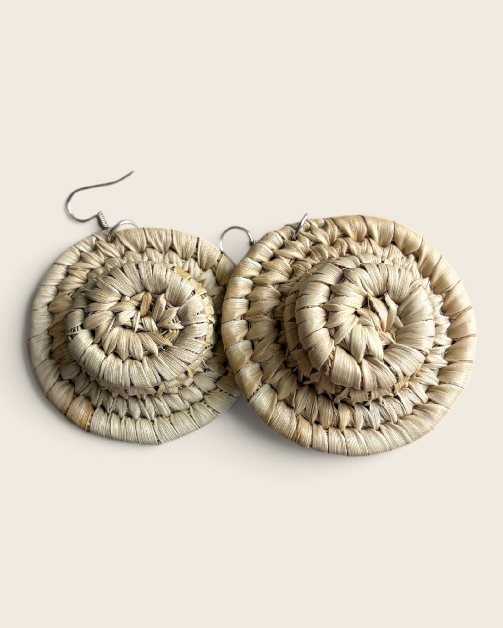 Natural undyed raffia halo earrings, a single coiled disc hand-woven in Nigeria, L'atelier KaAy