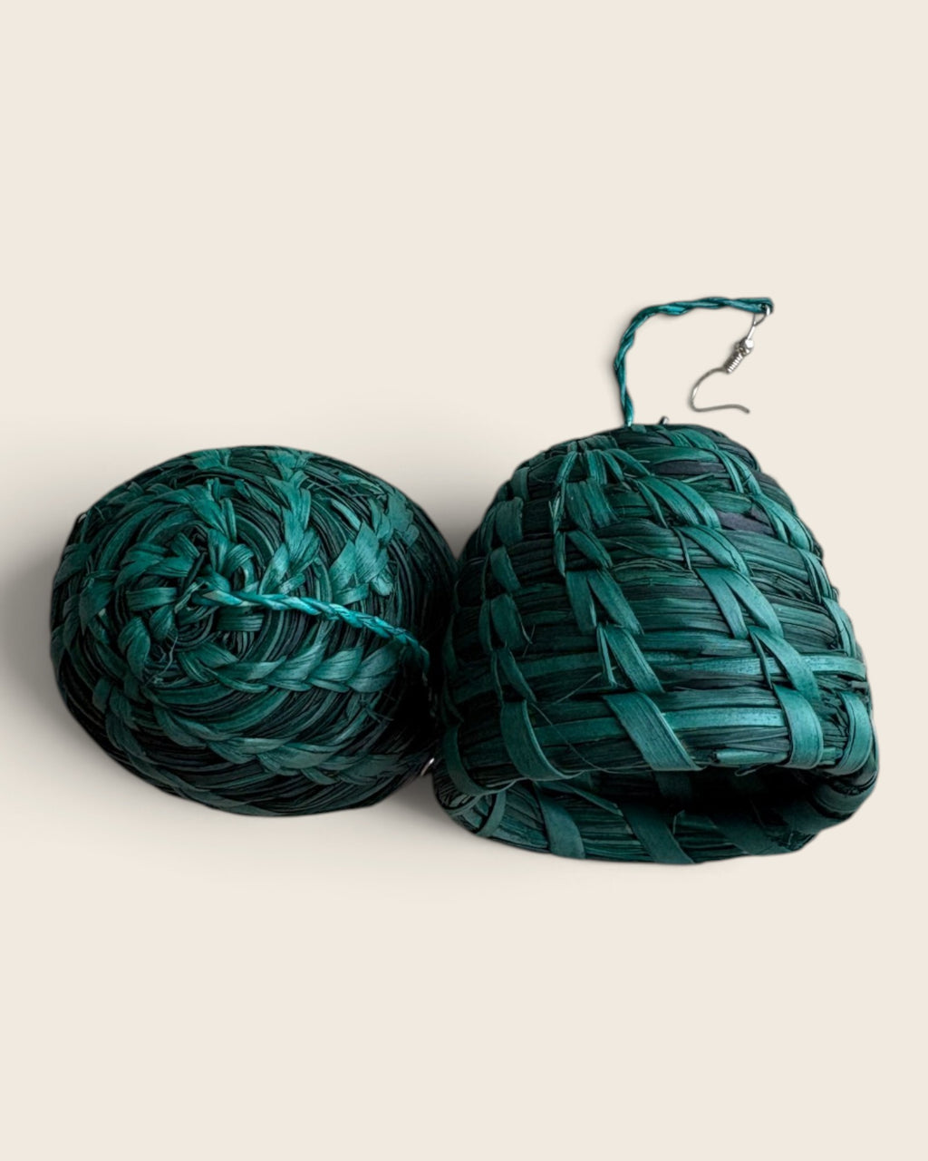 Close-up of the coiled weave on emerald raffia bell earrings with stainless steel ear wire, L'atelier KaAy
