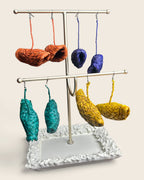 Zuri raffia half-moon earrings in Terracotta Ember, Cobalt Indigo, Malachite Teal and Saffron Gold, hand-woven in Nigeria