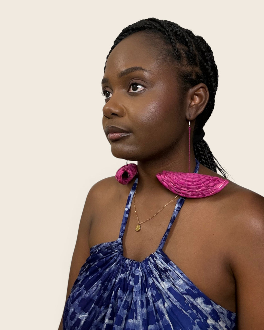 Model wearing Hibiscus Fuchsia hand-woven raffia half-moon drop statement earrings, L'atelier KaAy
