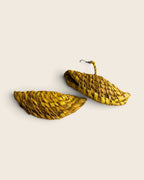 Pair of Saffron Gold woven raffia half-moon drop earrings shown flat, L'atelier KaAy